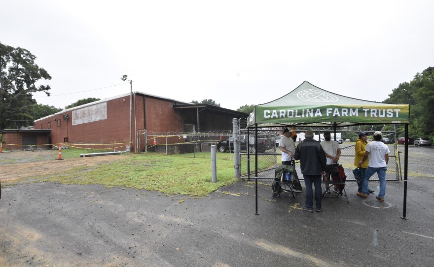 Volunteers welcomed guests to a groundbreaking ceremony at the Carolina Farm Trust's new warehouse at 511 South Hoskins Rd. on Aug. 3, 202