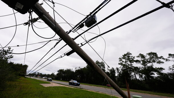 State troopers ride past downed power lines in the aftermath of Hurricane Isaias in Milton, Fla., Saturday, Oct. 10, 2026. (AP Photo/Gerald Herbert)