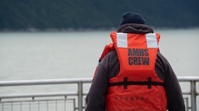 An Alaska Marine Highway System deckhand wears a life jacket labeled for crew use during an emergency drill aboard the ferry Hubbard on July 24, 2024. 