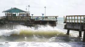 Part of Anglin's Fishing Pier is shown after it collapsed into the ocean after Hurricane Nicole arrived, Thursday, Nov. 10, 2022, in Lauderdale-by-the-Sea, Fla. Tropical Storm Nicole made landfall as a hurricane early Thursday near Vero Beach, Fla. It's such a sprawling storm that it has covered nearly the entire peninsula while reaching into Georgia and South Carolina. (AP Photo/Wilfredo Lee)