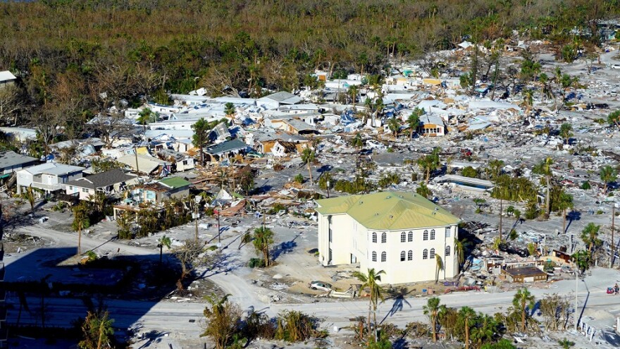 Destroyed houses and buildings are visible in Fort Myers Beach on Friday.