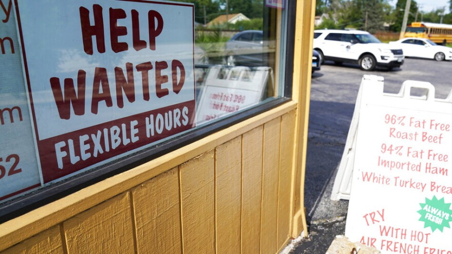 help wanted sign in a restaurant window 