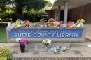 Flowers are left outside the Butte County Library in Chico, Calif. on June 25, 2026.