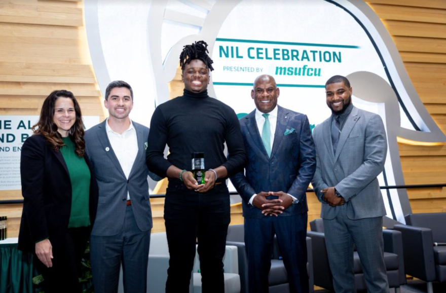 Tight end Maliq Carr accepts an award at the EverGreen NIL Celebration held at the Tom Izzo Hall of History.