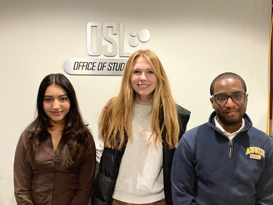 Augustana students Fatima Fqiyah (left) and Rachel Byrne, with Reynard Beschop, director of student activities, at Augie's Office of Student Life on Jan. 13, 2026.