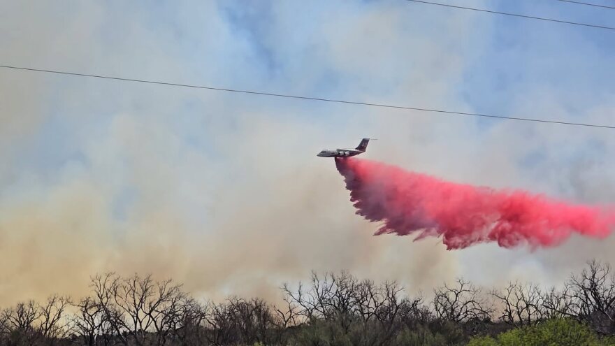 Large airtanker drops retardant on the Bell Fire in Dickens County, Texas.