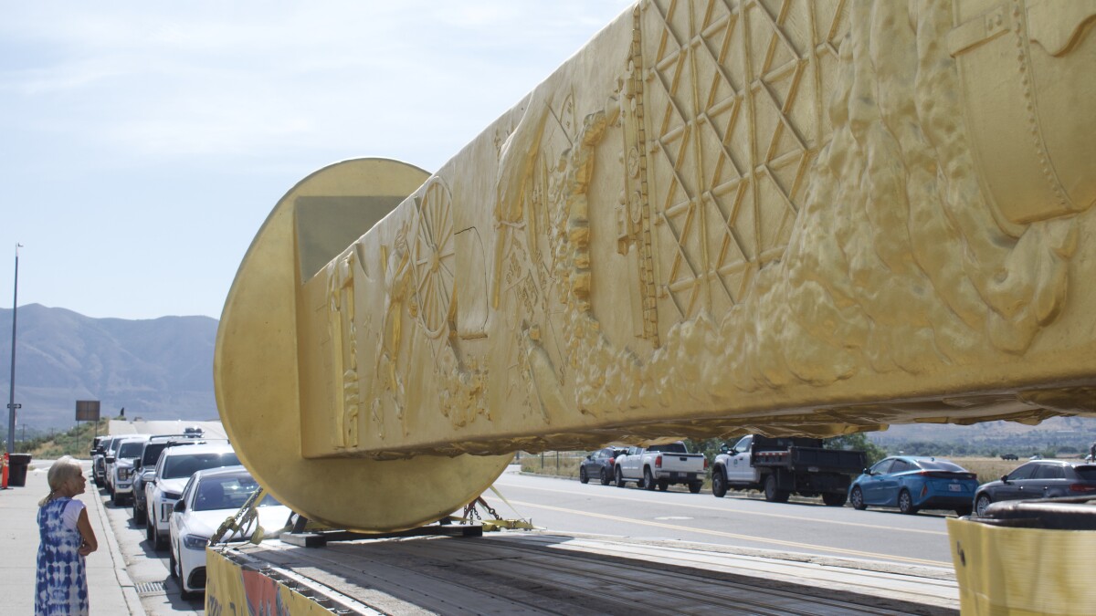 A massive golden spike sculpture is coming to northern Utah. Here’s how to see it