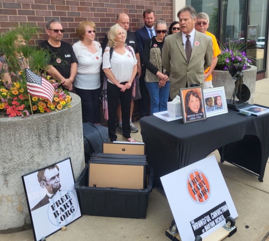 Chris Ross, cousin of Barton McNeil, stands with supporters for a news conference Tuesday where he called on the Illinois Attorney General’s office and governor to impanel a grand jury to investigate Misook Nowlin for murder. 