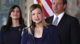 Barbara Lagoa, center, Governor Ron DeSantis' pick for the Florida Supreme Court, speaks after being introduced, as DeSantis and Lt. Gov Jeanette Nunez, left, look on, Wednesday, Jan. 9, 2019, in Miami.