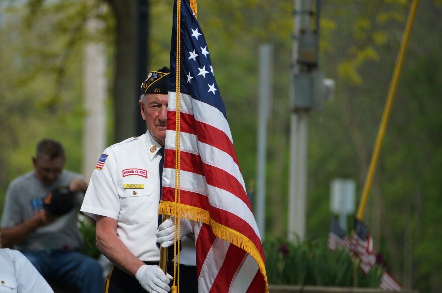 American Veteran holding American Flag