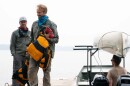 Brothers John Connelly, left, and Tom Connelly after they evacuated the Boundary Waters Canoe Area Wilderness with the help of tow boat driver Willy Vosburgh on Thursday at Moose Lake near Ely, Minn. | MPR