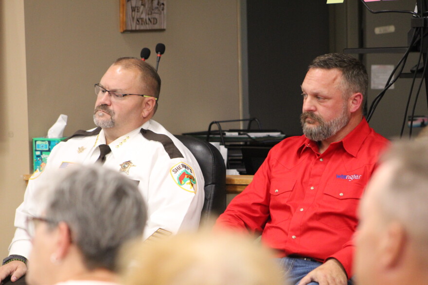 Sheriff Bryan Welk and his opponent, Deputy Aaron Ammerman, watch the forum preceding the sheriff's candidate forum Sept. 8, 2026, at Sylvan Town Hall in southern Cass County.