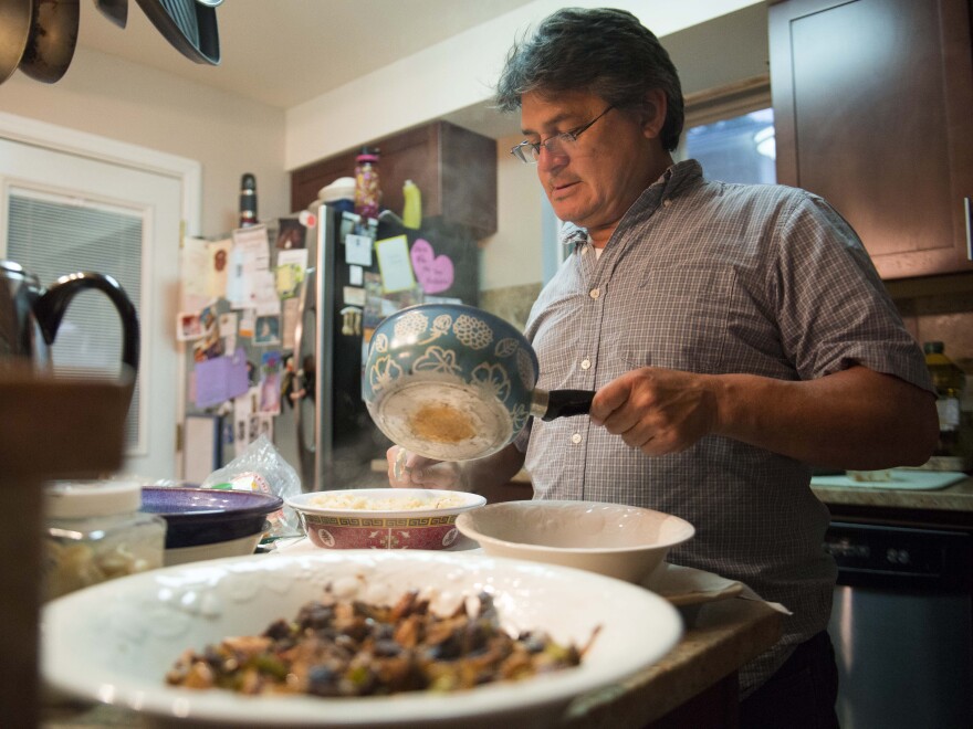 Carballo says many parents in Latin America teach their children that "men are to be served by their sisters." He tries to model a different approach by sharing cooking and other household duties with his wife.