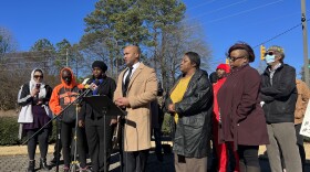 Social justice activists and family and community members stand during a press conference Jan. 24 at the Dr. Martin Luther King, Jr. Memorial Gardens in Raleigh. Kerwin Pittman (center) with Emancipate NC led the conversation. To his right stands the mother of Darryl Williams.