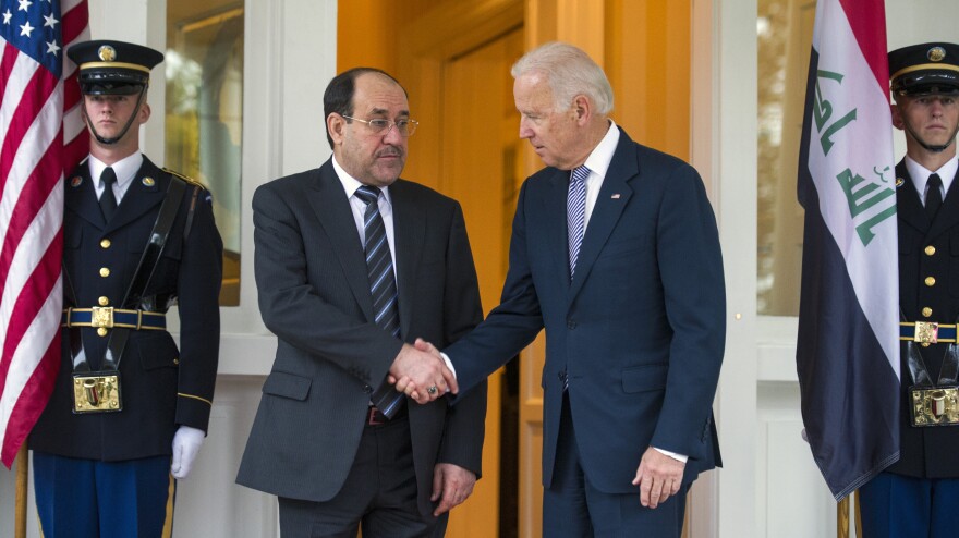 Iraqi Prime Minister Nouri al-Maliki is welcomed by Vice President Biden in Washington on Wednesday. Maliki is asking for U.S. military hardware to fight radical groups behind a recent surge in violence in Iraq.