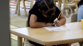 A student writes on a worksheet at Adelaide Lee Elementary in Oklahoma City on Aug. 11.