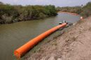 Border buoys are installed in the Rio Grande as it runs through Brownsville on March 6.