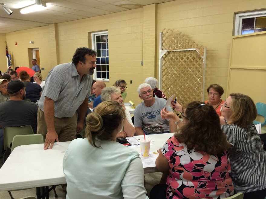 Community Improvement Coach Eric Pories interacts with a team at Monday night's workshop