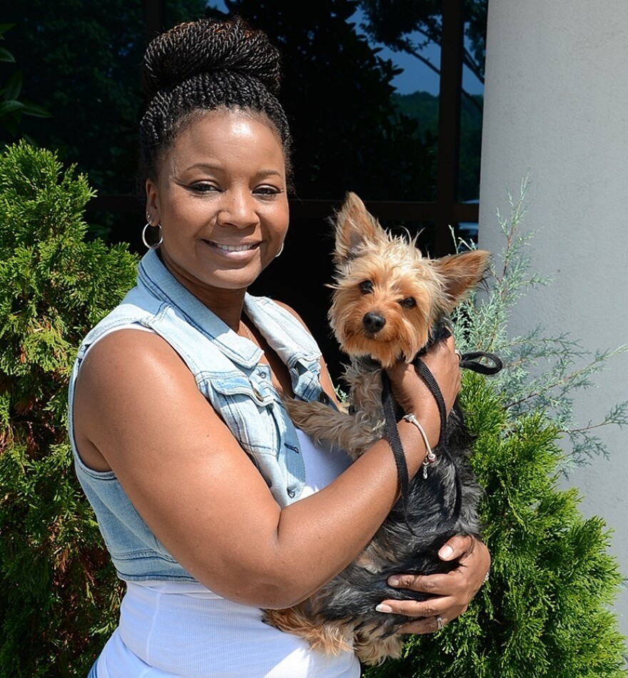 Kim Headen fills orders in the warehouse at Replacements Ltd. and brings her Yorkshire terrier, Charlie, to work. The company currently has 400 employees and 30 animals that come to work.