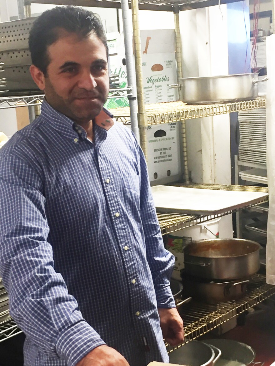 Syrian refugee Hani Hamou works as a dishwasher at the Fresh Salt restaurant in Old Saybrook, Conn.