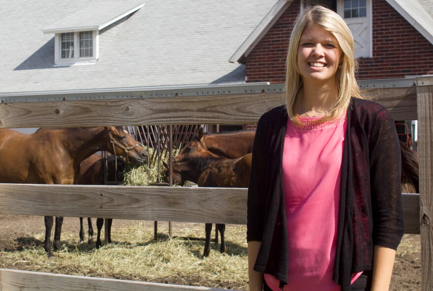 Haley Banwart, pictured at the Iowa State horse barn, grew up on her family's farm. She is working and getting a master's degree at Iowa State. Her brother plans to return home to farm after college.