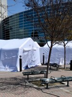 Tents setup outside the main entrance to Harbor-UCLA Medical Center in Torrance, Calif., Wednesday, April 1, 2020. The hospital plans to triple the number of available ICU beds to care for patients amidst the spread of COVID-19.