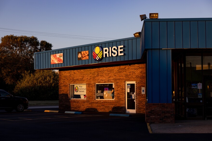 The sun sets over Rise Community Market.