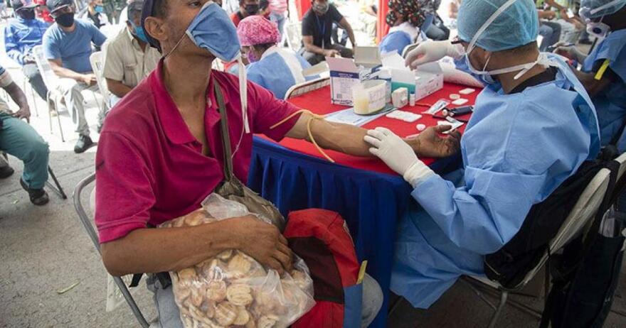 A Venezuelan man gets tested for COVID-19 this summer in Caracas.