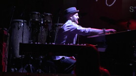 Lao Tizer playing a keyboard