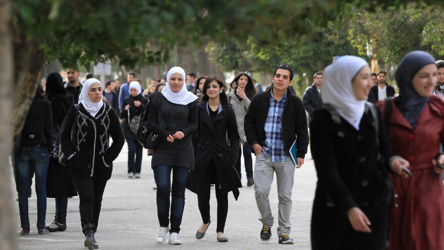 Syrian students on campus at a Damascus University in 2012, a year after the war started.