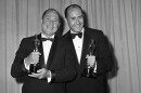 Composers Johnny Mercer, left, and Henry Mancini pose with their Oscars they won for Best Song used in a Motion Picture, the Days of Wine and Roses, at the Academy Awards, in Santa Monica, Ca., on April 8, 1963. (AP Photo)