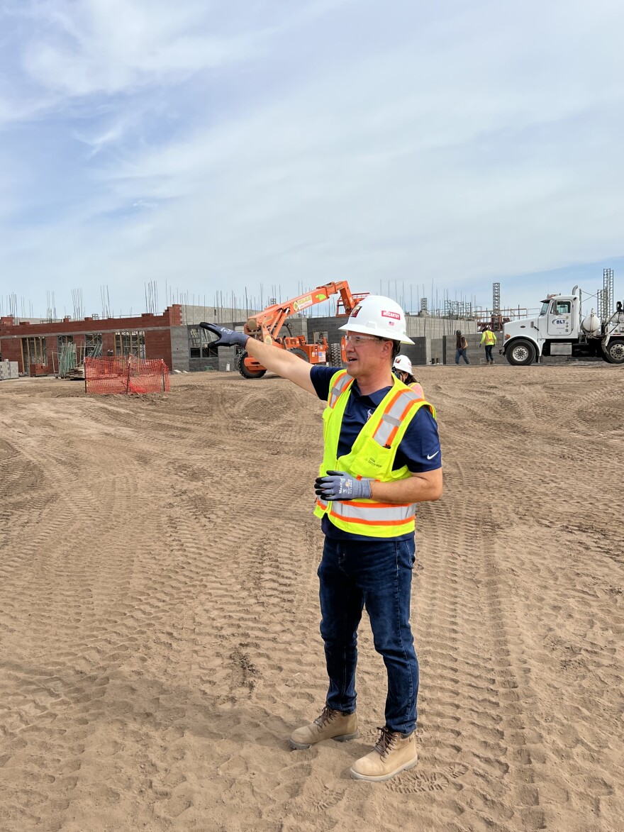 Somerton High School Principal Lucky Arvizo speaks to reporters and Yuma Union High School District officials during a tour of the construction site on Friday, July 22, 2022.