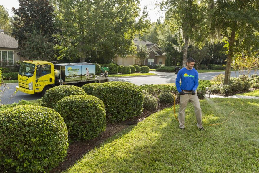 The Masters Lawn Care lawn and ornamental health manager, Chase McNeal, treats a local lawn.