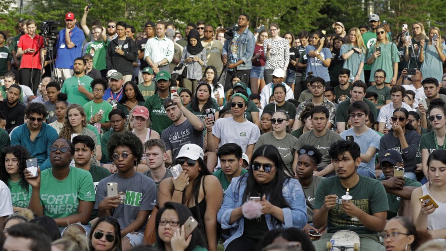 Students attend a vigil at the University of North Carolina's Charlotte campus to honor the victims of Tuesday's shooting.