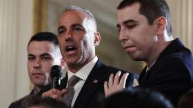 Andrew Pollack, father of slain Marjory Stoneman Douglas High School student Meadow Jade Pollack, joined by his sons, speaks during a listening session with President Donald Trump in February 2018.