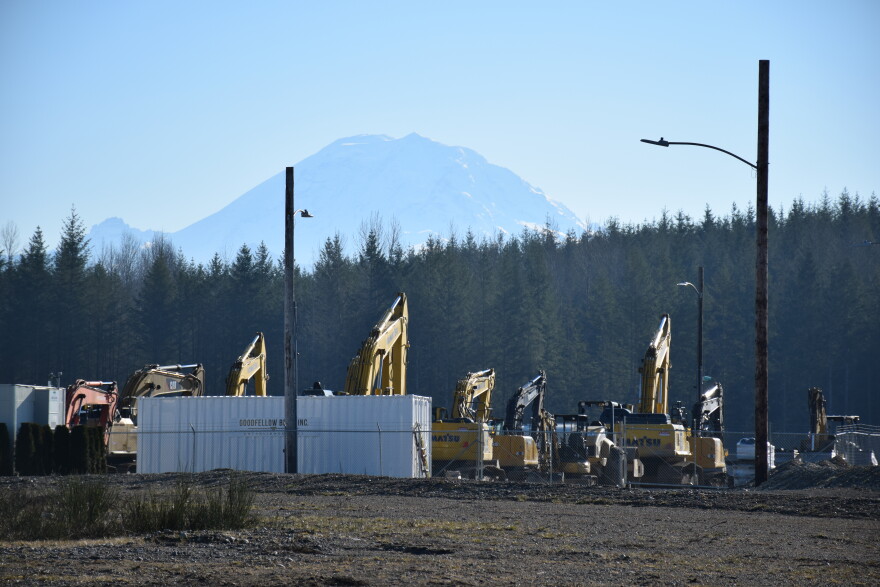 Mount Rainier looms behind the site of the Oakpointe development in Black Diamond, Washington.