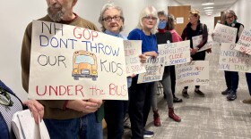 David Tucker of Concord protests at the State House during a hearing over the latest open enrollment education bill.