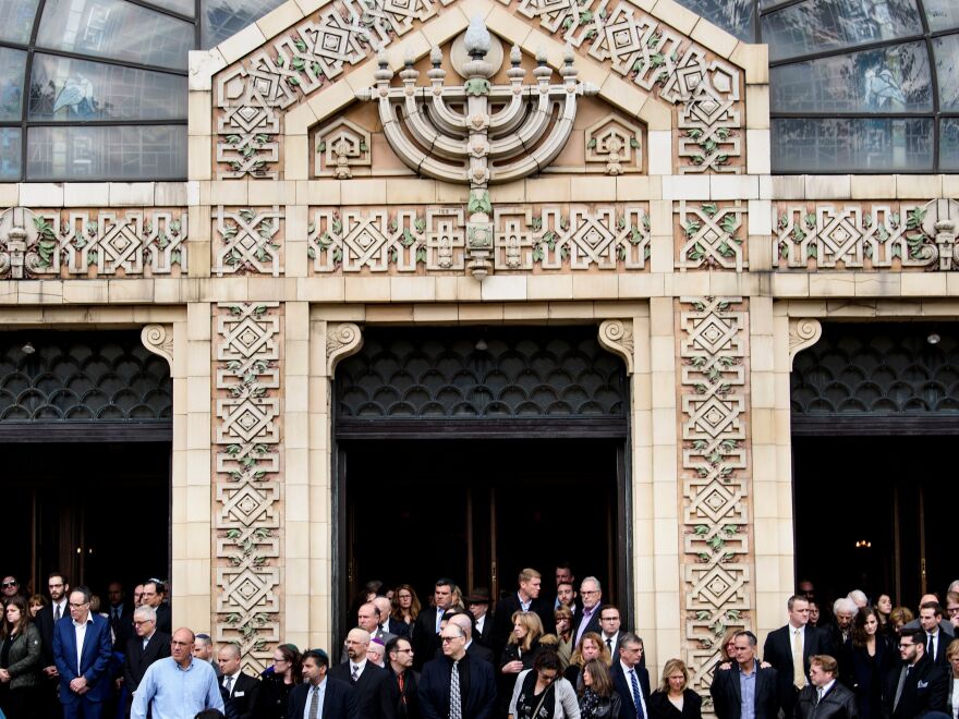 People leave Rodef Shalom Congregation after a funeral for Tree of Life Congregation mass shooting victims Cecil Rosenthal and David Rosenthal Tuesday in Pittsburgh, Pa.