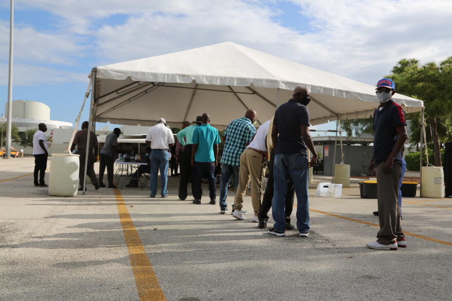 A line of people who drive taxis at Miami International Airport formed to get a COVID-19 vaccine on May 10, 2021.