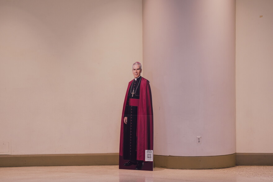 A life-size cutout of the late Archbishop Fulton J. Sheen stands in an expo hall ahead of his beatification Mass on Thursday.