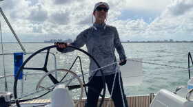  Marc Dorfman steers a sailboat in Biscayne Bay. 