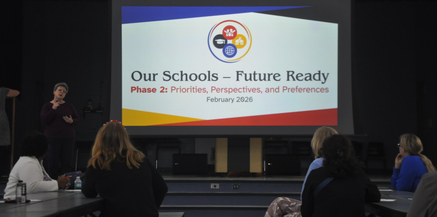 Kathie Ebaugh, a community planner for local civil engineering firm JBPro, begins her presentation in Kanapaha Middle School’s cafeteria.