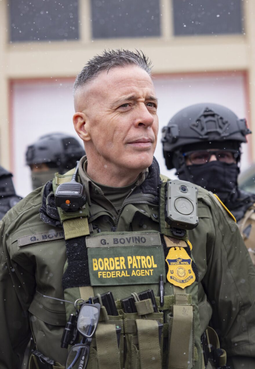 Gregory Bovino, former U.S. Border Patrol “commander at large,” stands in the street after exiting his vehicle in Minneapolis in January 2026. Bovino oversaw controversial immigration enforcement operations in Minneapolis that resulted in the shooting deaths of two Americans before being reassigned.