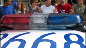 Protesting Gallaudet students block a Washington, D.C., police car from entering the campus Thursday.