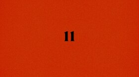 A black 11 on a red background