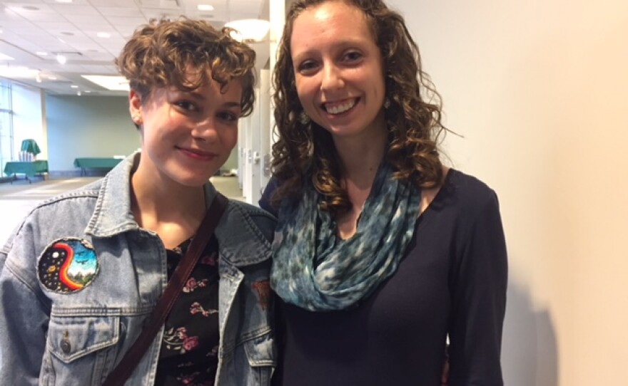A high school student poses with her teacher