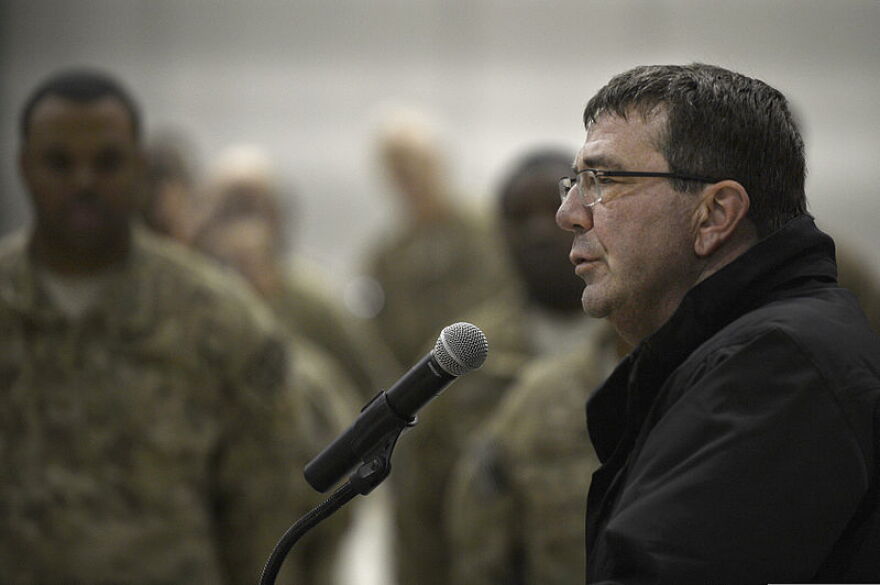 U.S. Deputy Secretary of Defense Ash Carter, right, speaks with Service members at Bagram Airfield, Afghanistan, Nov. 28, 2013.