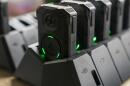 Axon body cameras charge on a docking station at Oklahoma City police headquarters on Friday, May 31, 2024 in Oklahoma City, Oklahoma. (Nick Oxford/AP)