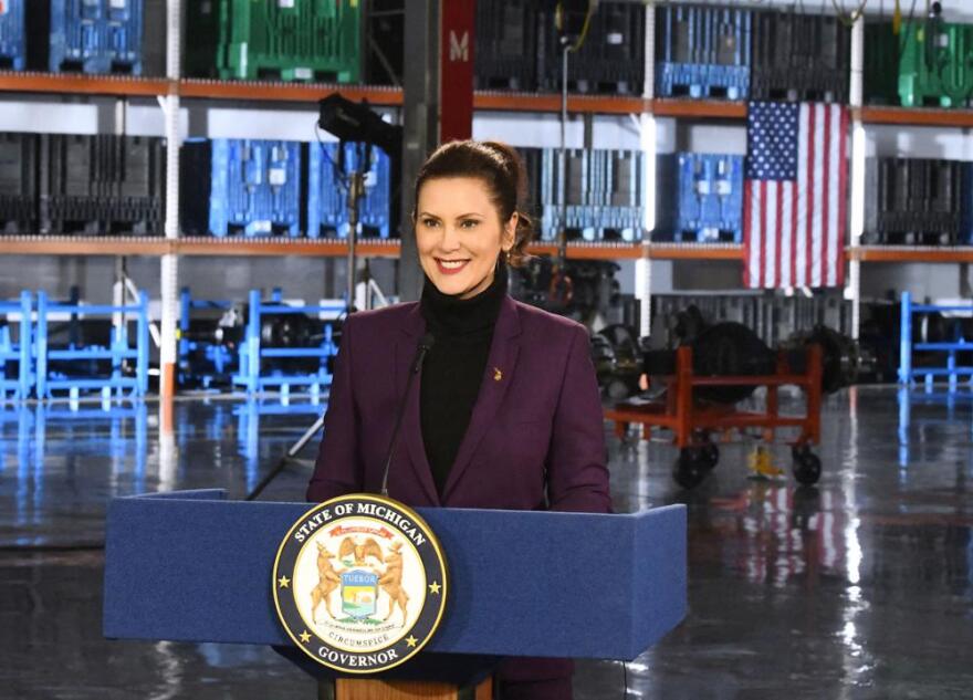 Michigan Gov. Gretchen Whitmer stands behind a podium before a pre-taping of her State of the State address