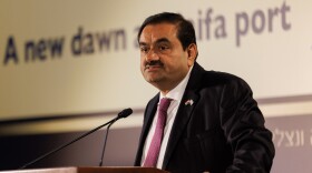 Gautam Adani, billionaire and chairman of Adani Group, speaks during an event at Israel's Port of Haifa, on Tuesday. The Indian billionaire, whose business empire was rocked by allegations of fraud by short seller Hindenburg Research, said his company will make more investments in Israel.